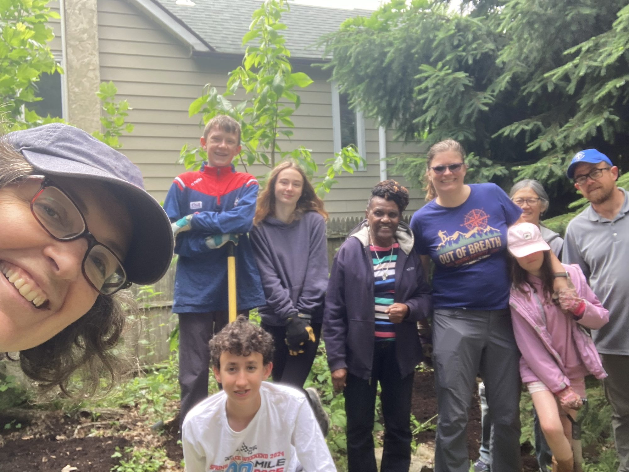 Sylke Jackson with volunteers and scouts planting in the community garden